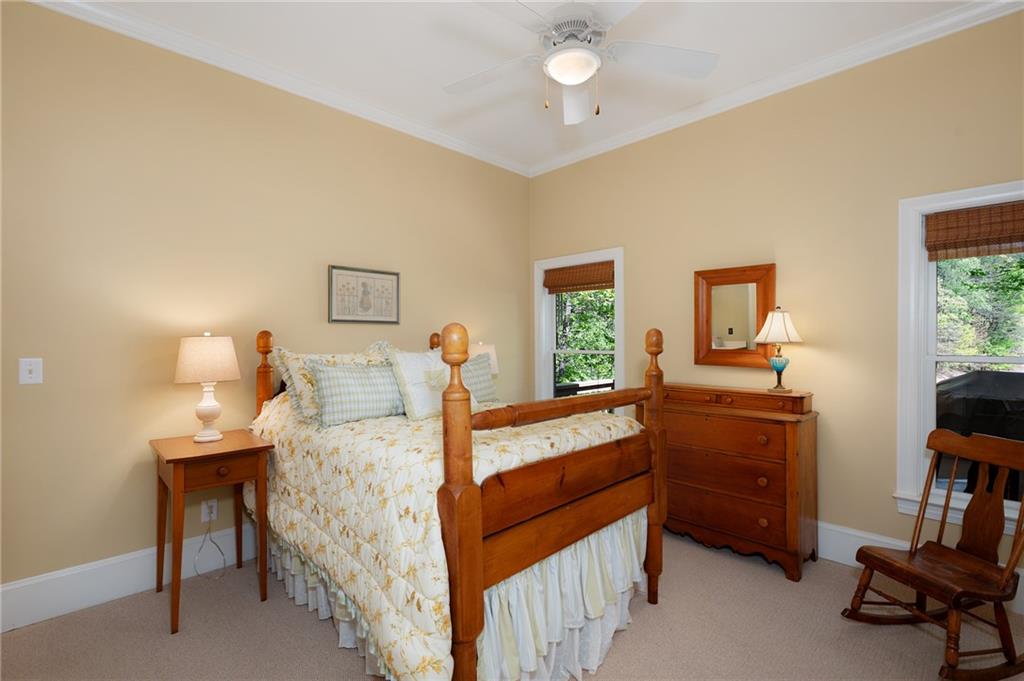 208 Muirfield Way Jasper, GA 30143 - Photo 32 of 59 a bedroom with a bed and a furniture