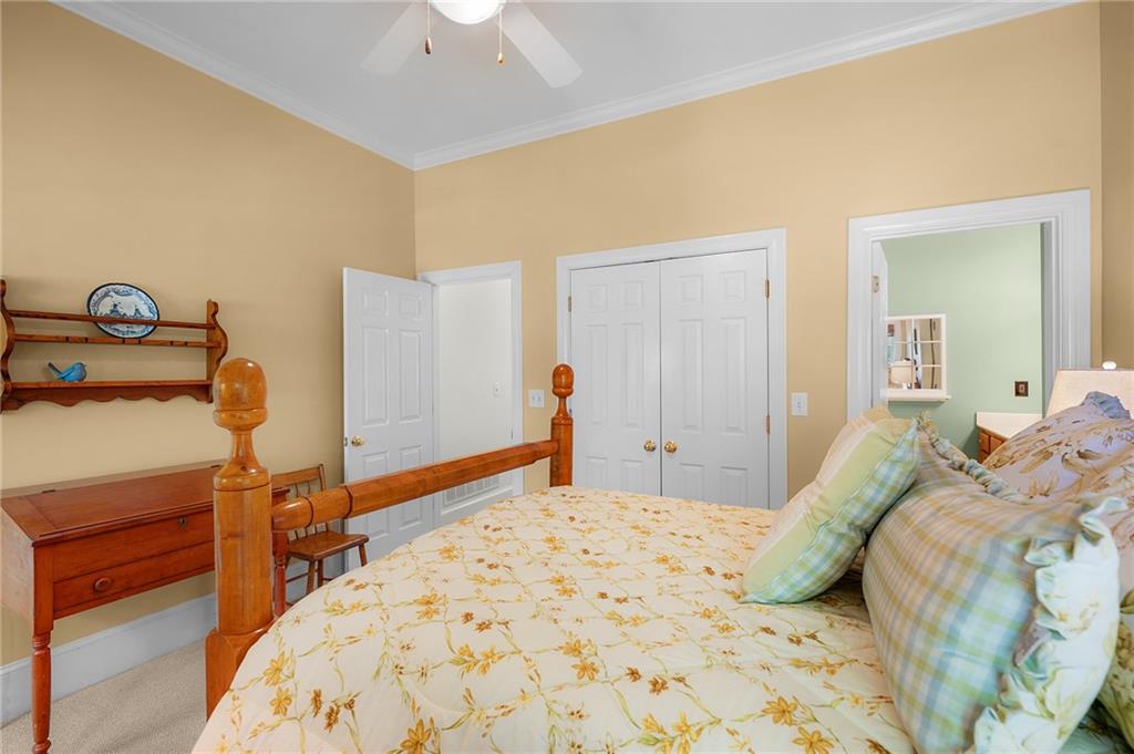 208 Muirfield Way Jasper, GA 30143 - Photo 33 of 59 a bedroom with a bed and a dresser