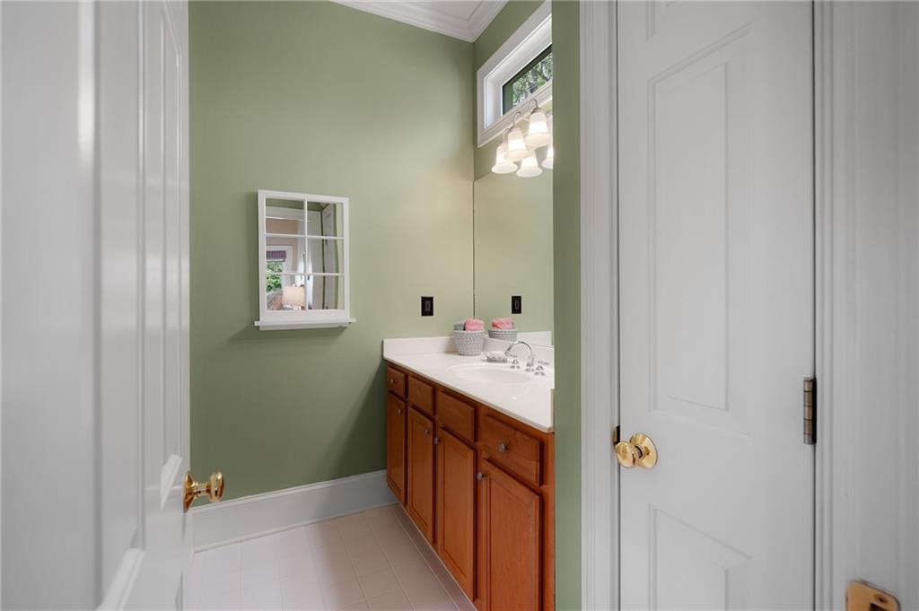 208 Muirfield Way Jasper, GA 30143 - Photo 34 of 59 a bathroom with a sink and a mirror