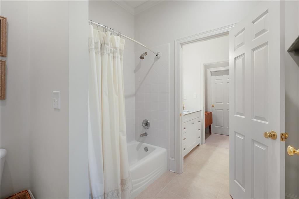 208 Muirfield Way Jasper, GA 30143 - Photo 46 of 59 a bathroom with a tub shower and a sink