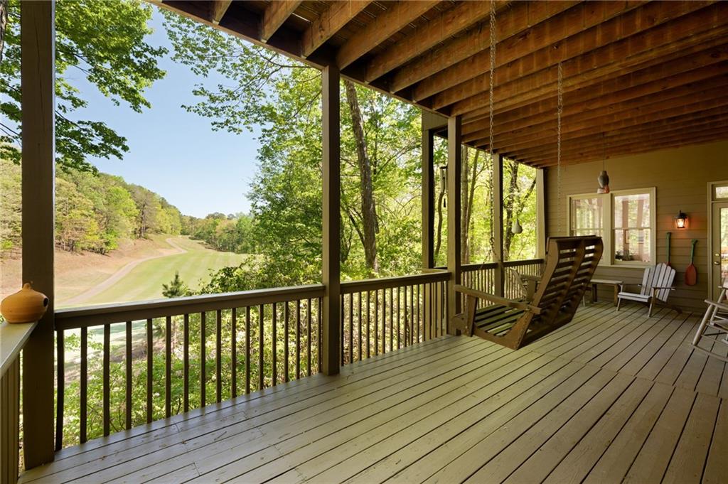 208 Muirfield Way Jasper, GA 30143 - Photo 51 of 59 a view of a balcony with wooden floor