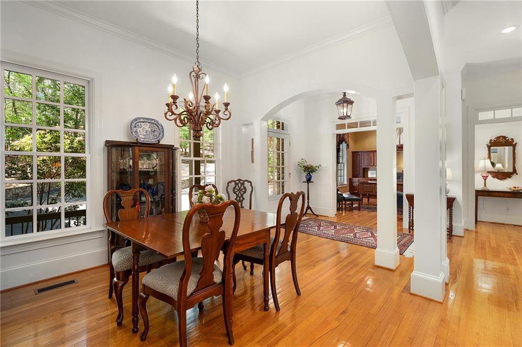 208 Muirfield Way Jasper, GA 30143 - Photo 6 of 59 a dining room with furniture a chandelier and wooden floor
