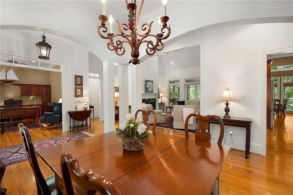 208 Muirfield Way Jasper, GA 30143 - Photo 7 of 59 a view of a dining room with furniture a chandelier and wooden floor