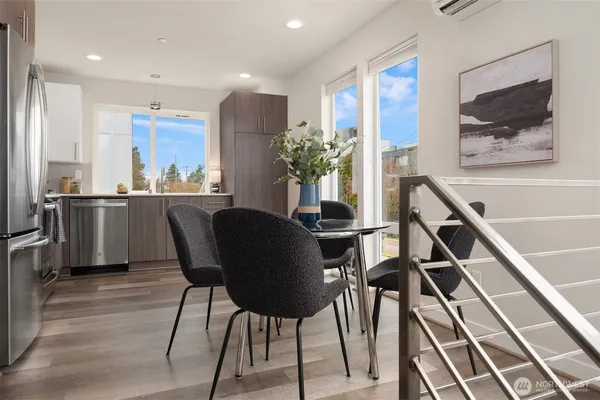 a dining room with furniture and window