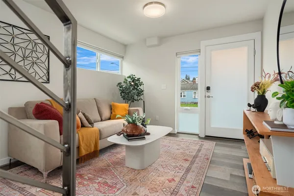 a bedroom with a bed and a lamp on dresser
