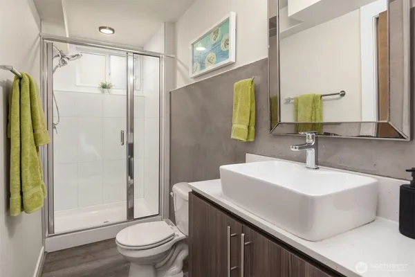 a en suite bathroom with a sink and mirror