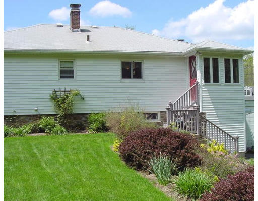 10 Wedgewood Road Sturbridge, MA 01566 - Photo 3 of 14 a front view of a house with garden