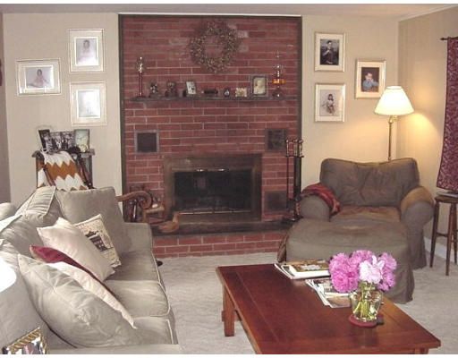 10 Wedgewood Road Sturbridge, MA 01566 - Photo 4 of 14 a living room with furniture wooden floor and a fireplace