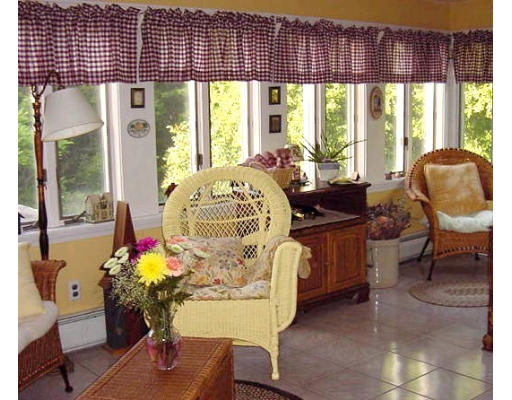 10 Wedgewood Road Sturbridge, MA 01566 - Photo 6 of 14 a living room with furniture and a floor to ceiling window