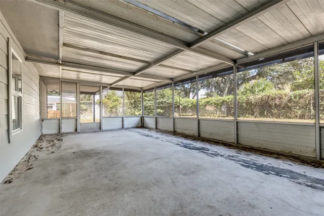 a view of an empty room with a sliding door