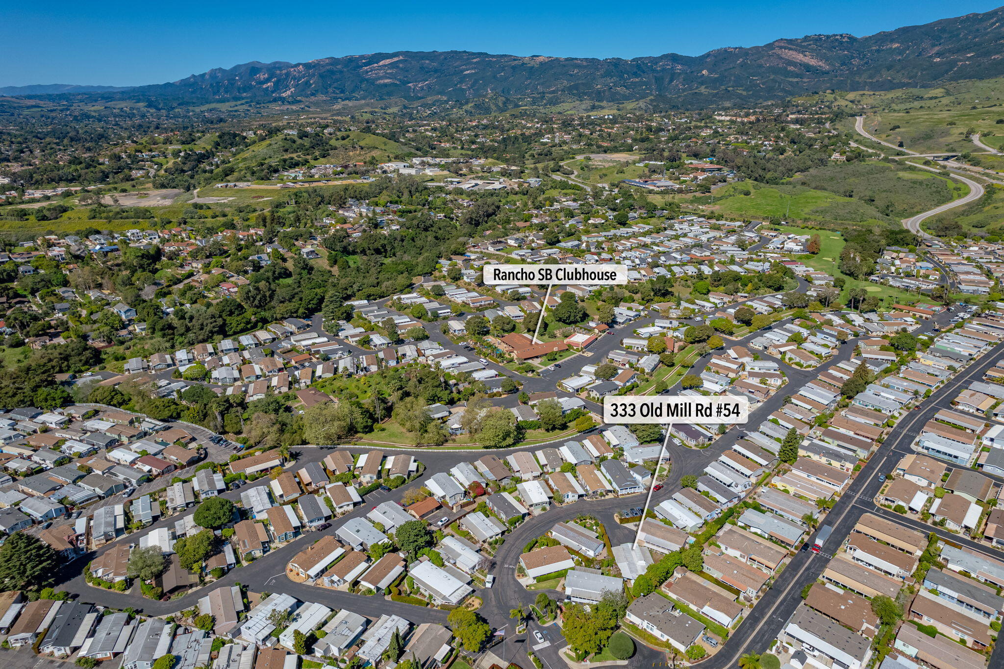 a view of a city with mountains in the background