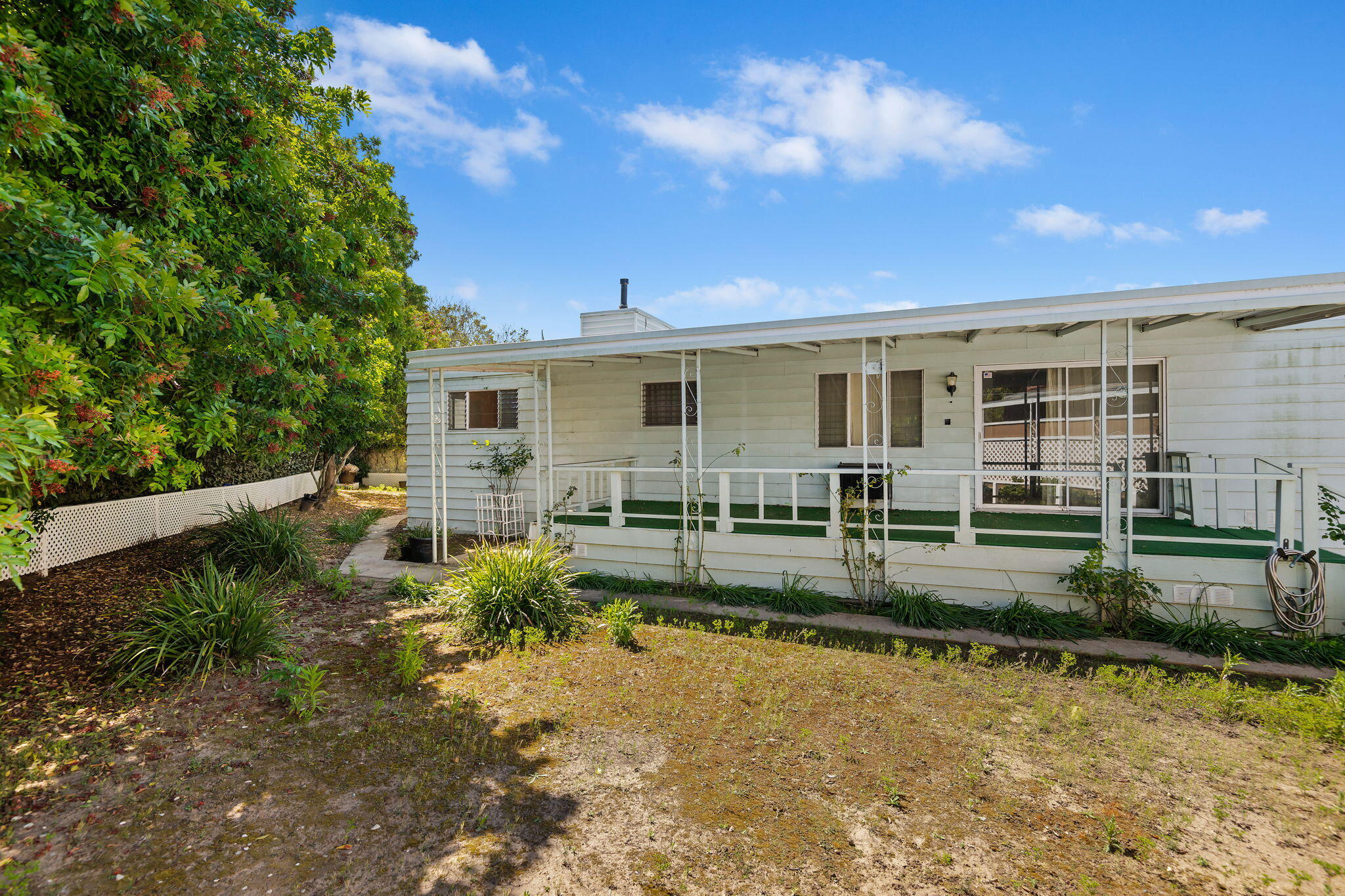 333 Old Mill Road, Unit 54 Santa Barbara, CA 93110 - Photo 7 of 13 a view of a house with backyard and sitting area