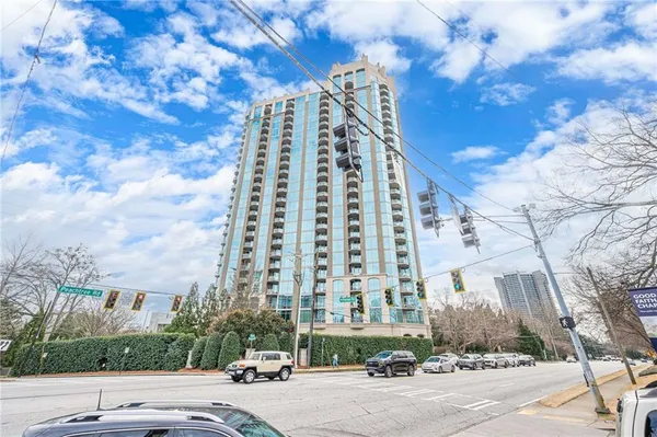 a city street lined with buildings and trees