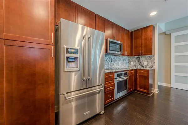a large kitchen with a sink and dishwasher