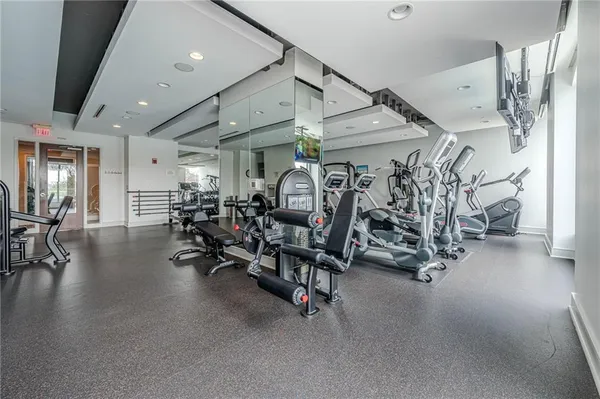a view of a patio with table and chairs potted plants with wooden floor