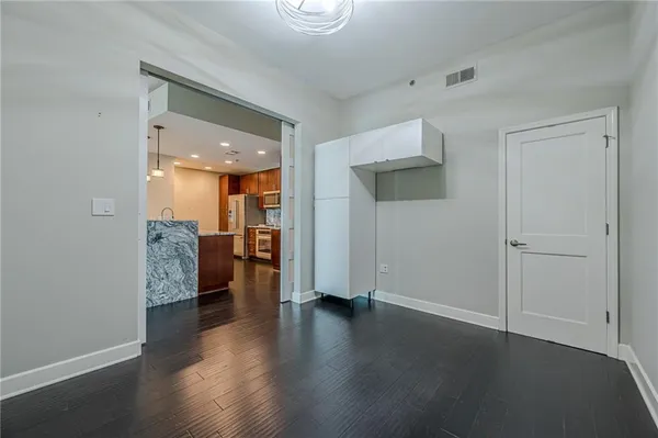 a view of a electric appliances in kitchen and empty room
