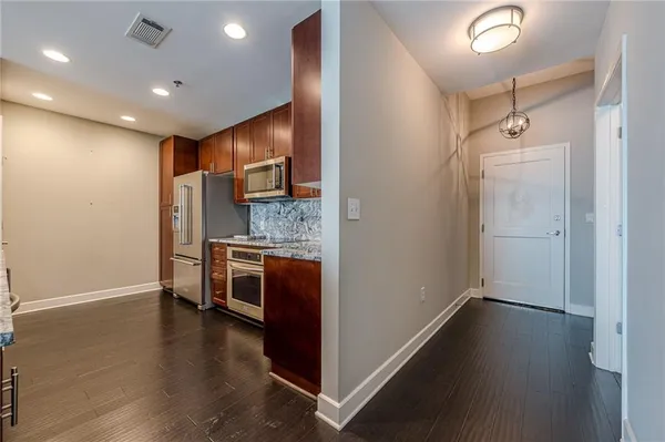 a kitchen with stainless steel appliances granite countertop a stove and a sink