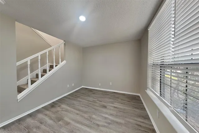 a view of an entryway with wooden floor