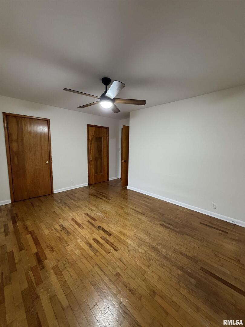 1806 Market Street Metropolis, IL 62960 - Photo 14 of 18 a view of an empty room and wooden floor