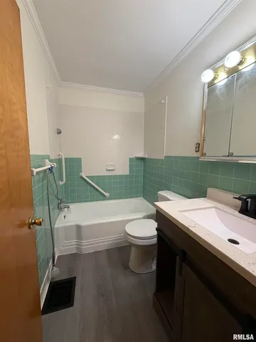 a bathroom with a sink a toilet and a bathtub