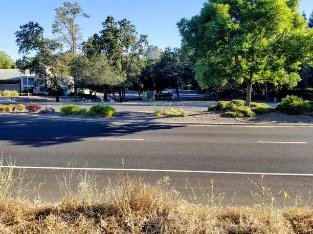 a view of a swimming pool and a yard