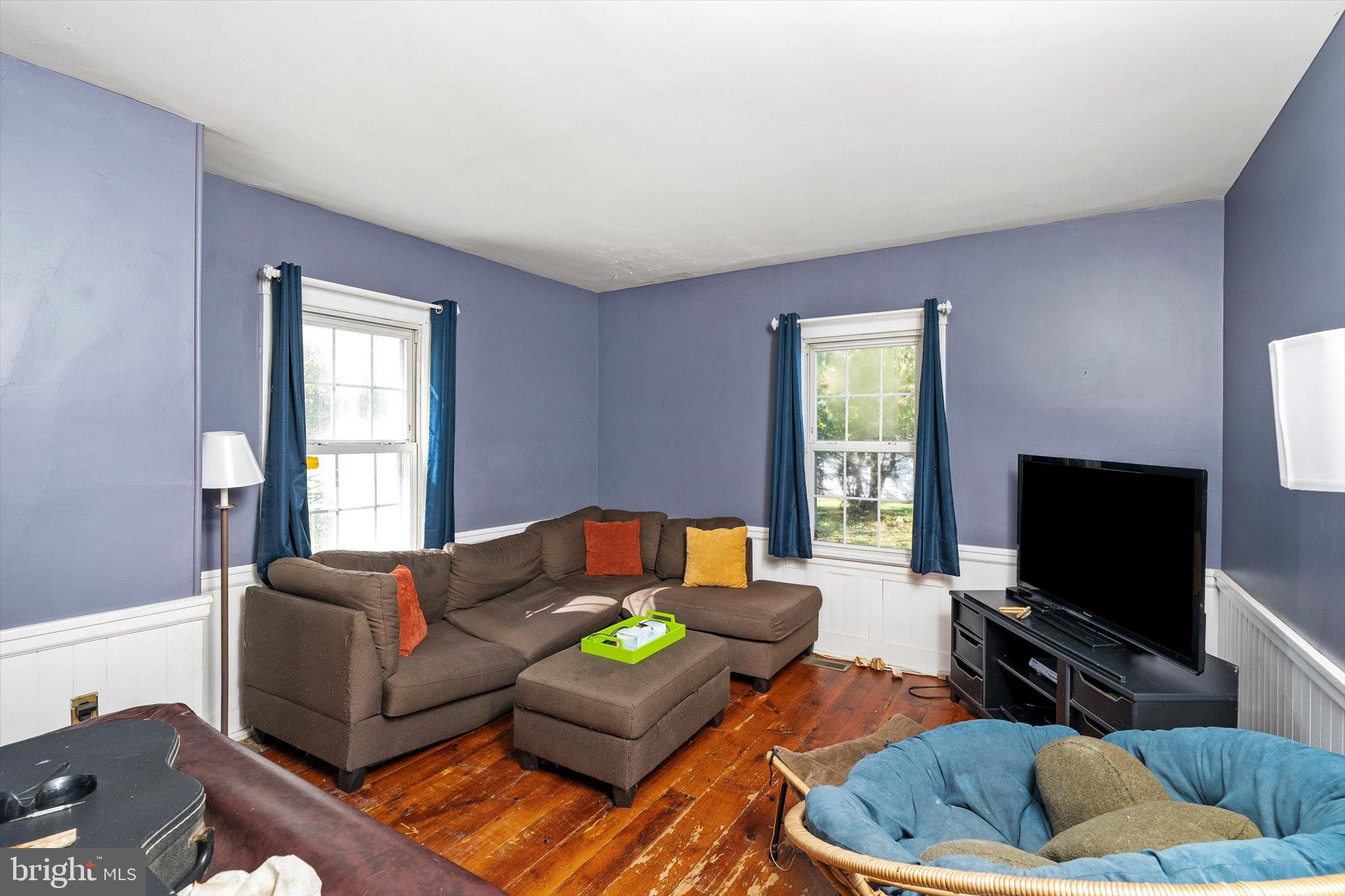 537 Arneytown-chesterfield Road Chesterfield, NJ 08515 - Photo 24 of 87 a living room with furniture and a flat screen tv