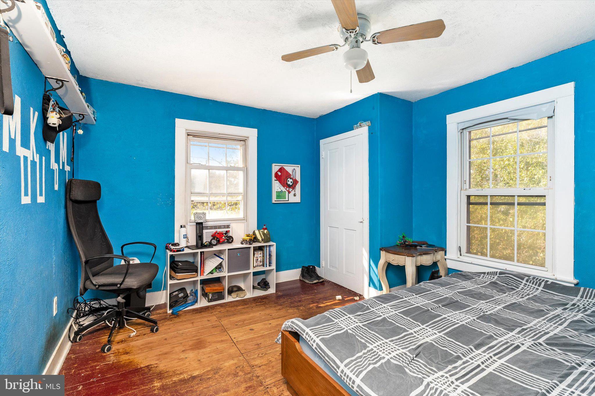 537 Arneytown-chesterfield Road Chesterfield, NJ 08515 - Photo 32 of 87 a bedroom with a bed a table and a chandelier
