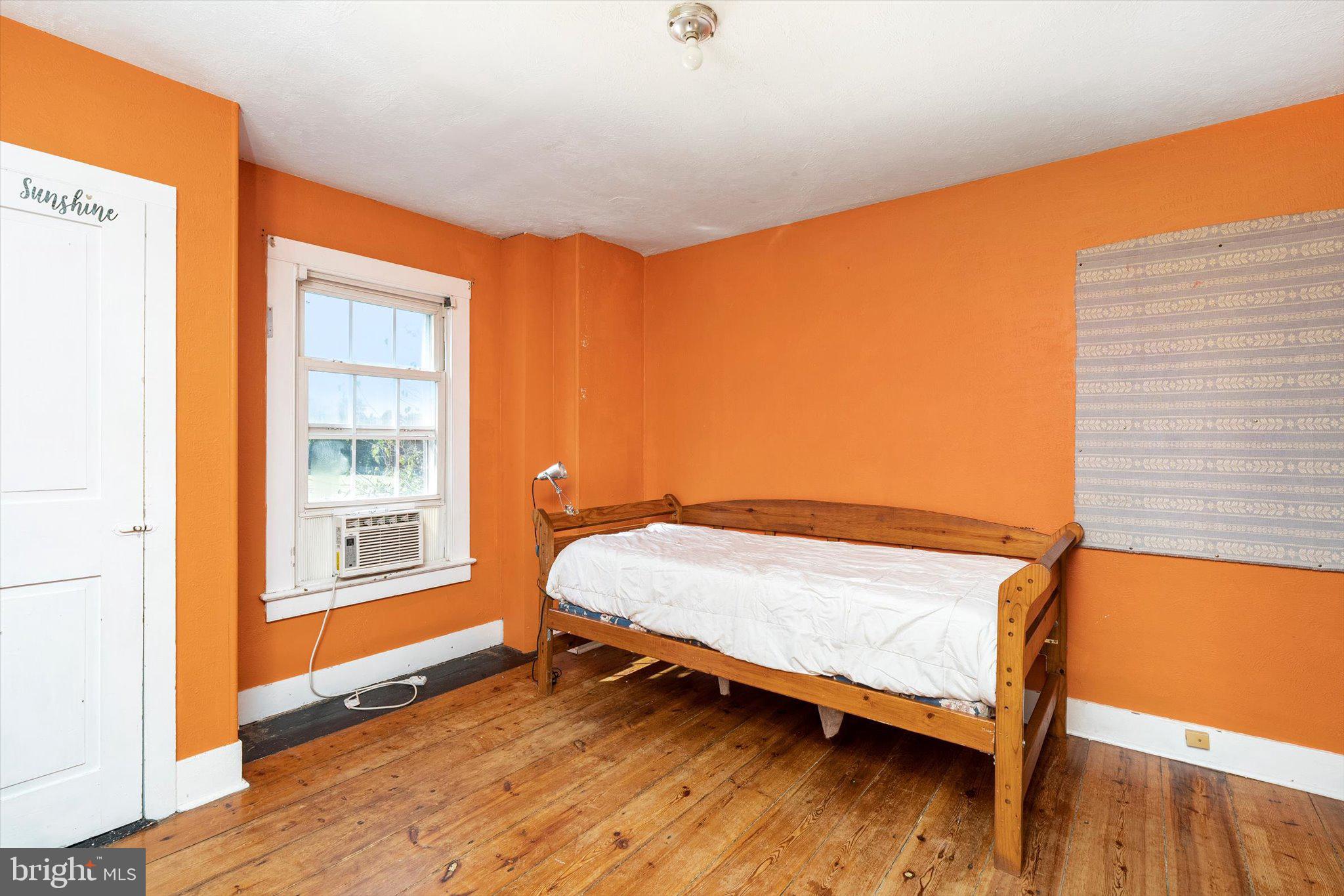 537 Arneytown-chesterfield Road Chesterfield, NJ 08515 - Photo 35 of 87 a bedroom with a bed and wooden floor