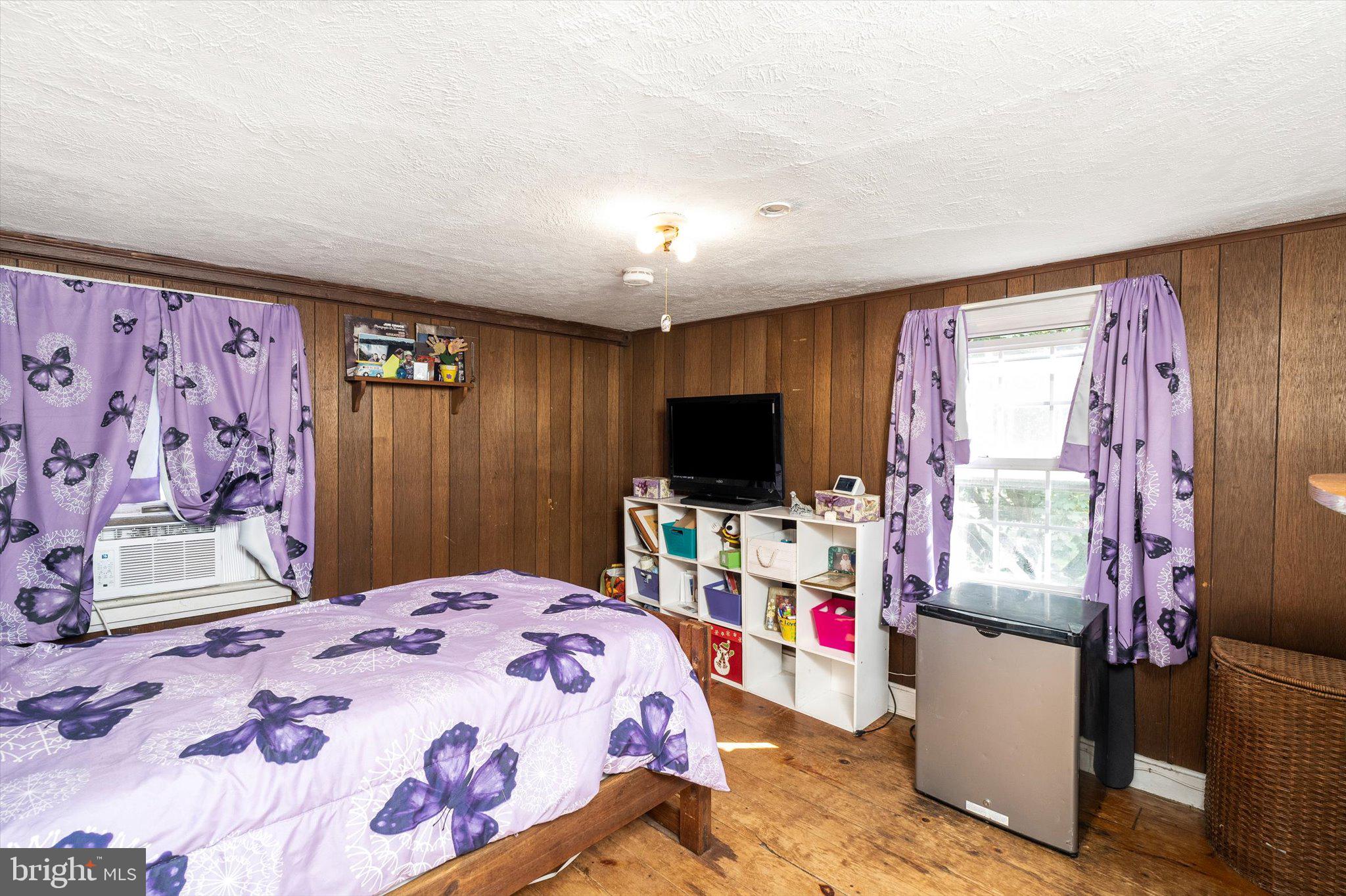 537 Arneytown-chesterfield Road Chesterfield, NJ 08515 - Photo 39 of 87 a bedroom with a bed and a flat screen tv