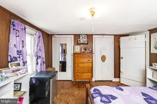 a living room with furniture a ceiling fan and a rug