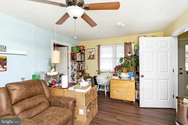 a room with furniture a chandelier and a large mirror