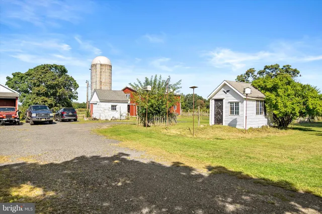 a view of a house with swimming pool and a yard