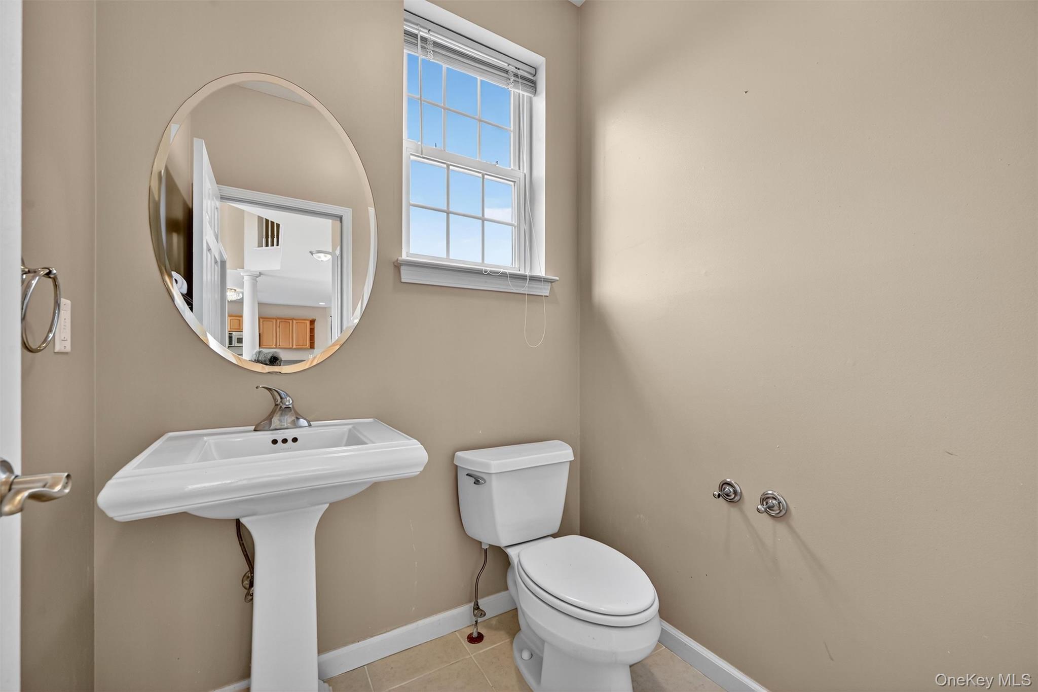 12 Heather Ridge Highland Mills, NY 10930 - Photo 11 of 41 a bathroom with a toilet sink and mirror