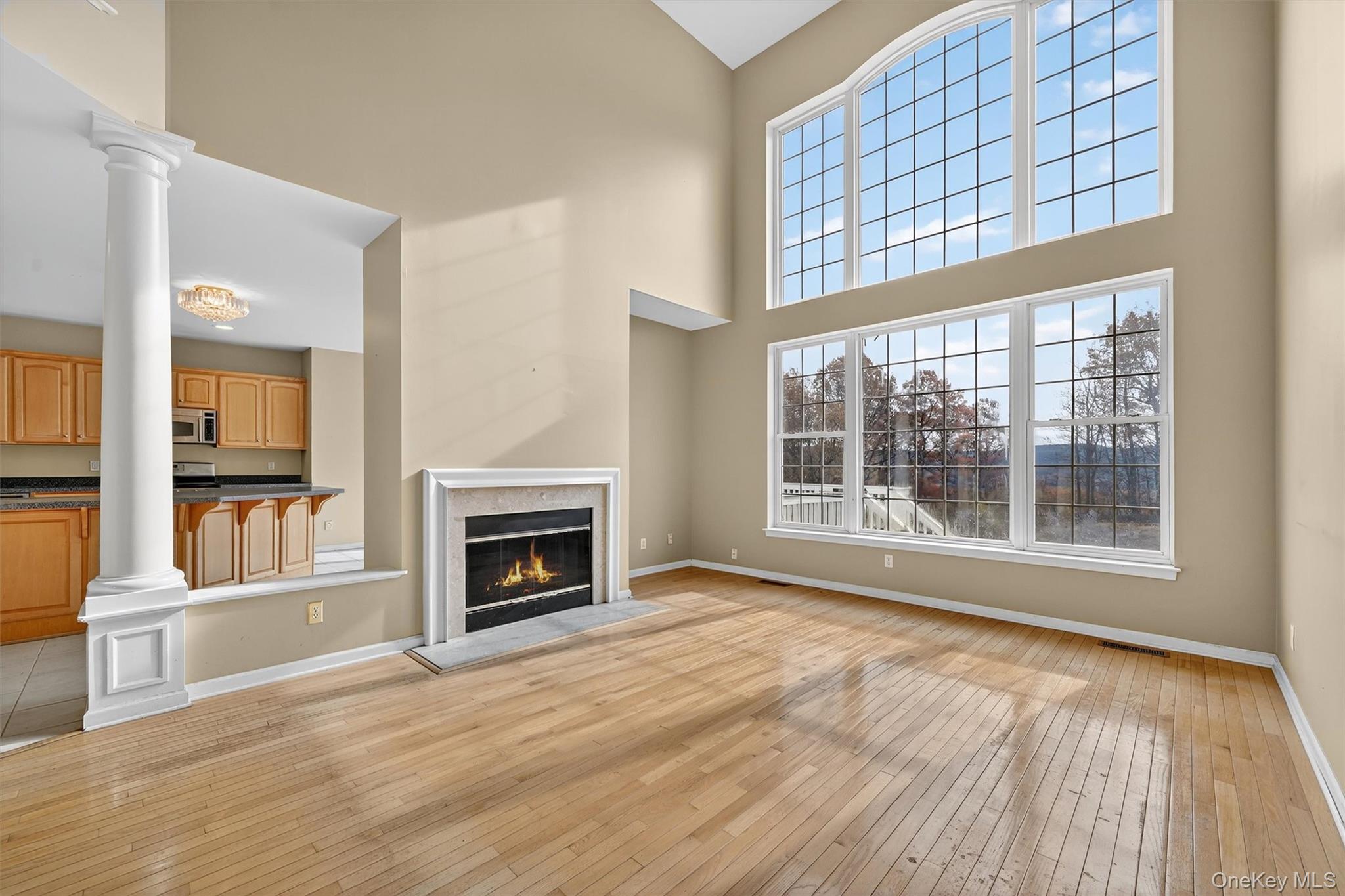 12 Heather Ridge Highland Mills, NY 10930 - Photo 13 of 41 a view of an empty room with wooden floor and a window