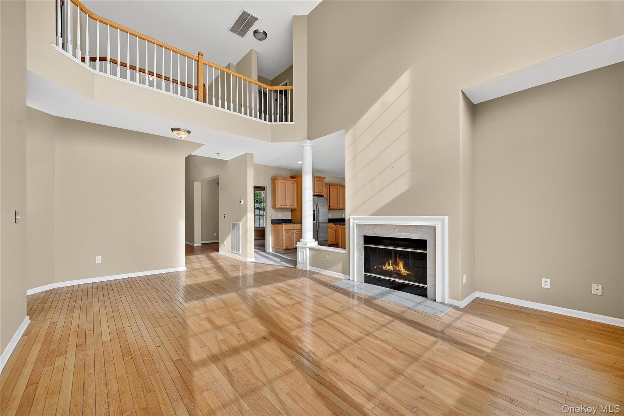 12 Heather Ridge Highland Mills, NY 10930 - Photo 14 of 41 a view of an empty room with wooden floor fireplace and a window