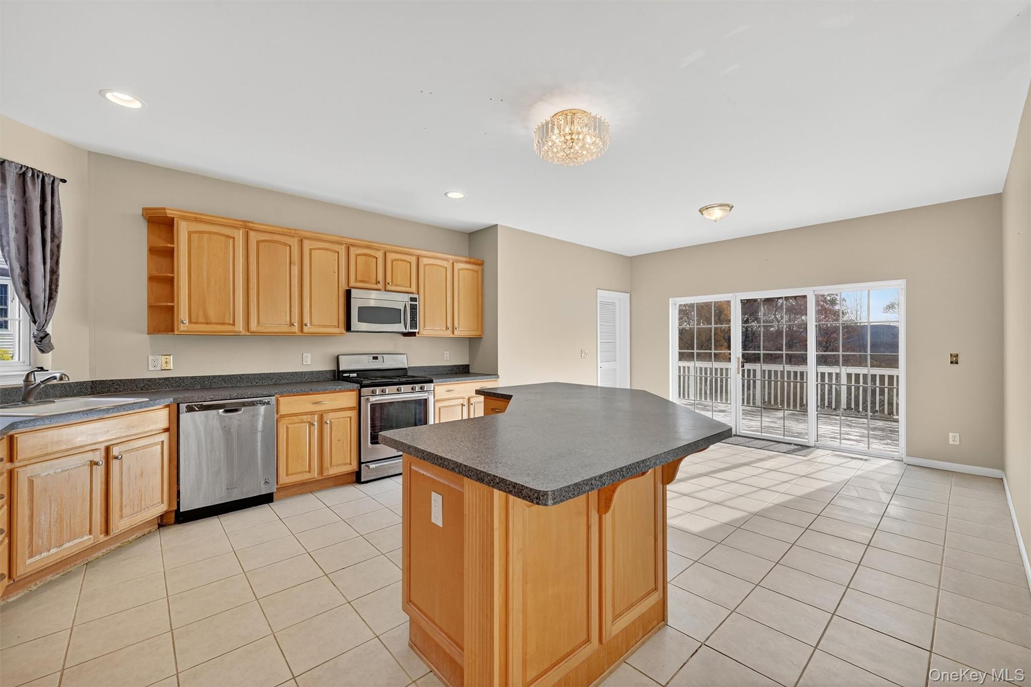 12 Heather Ridge Highland Mills, NY 10930 - Photo 15 of 41 a kitchen with stainless steel appliances granite countertop a stove a sink a microwave and a refrigerator