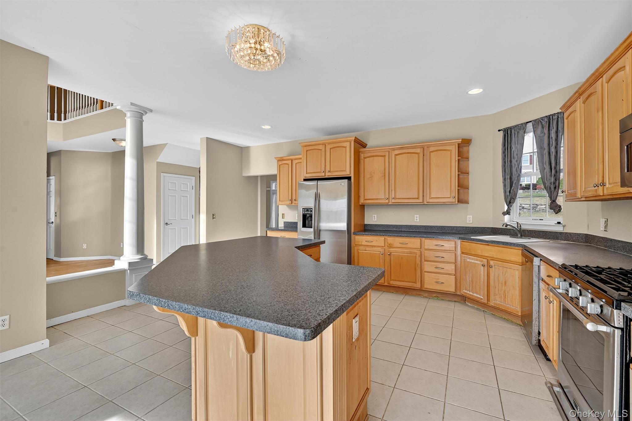 12 Heather Ridge Highland Mills, NY 10930 - Photo 17 of 41 a kitchen with granite countertop a sink a stove cabinets and counter space