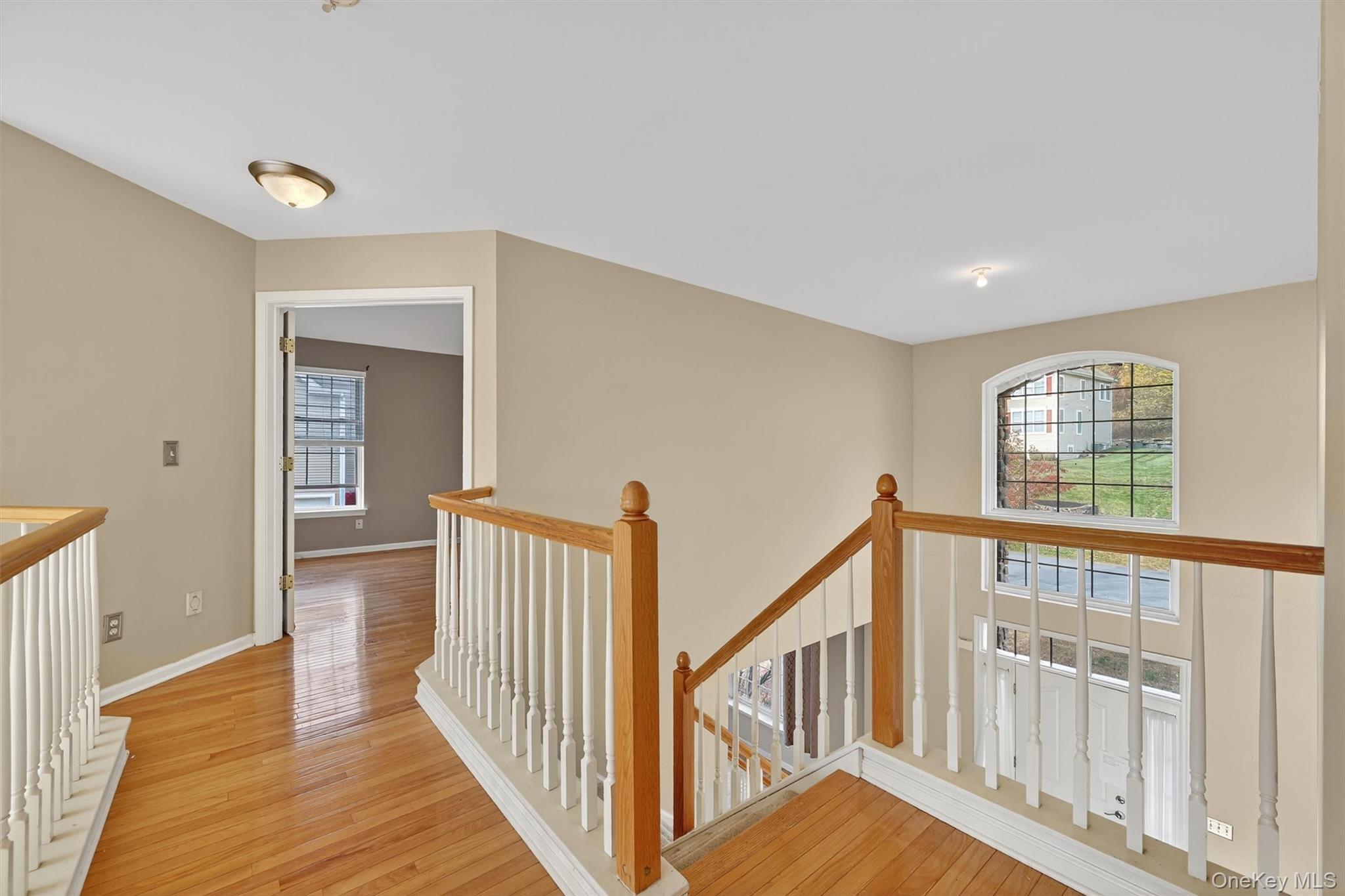 12 Heather Ridge Highland Mills, NY 10930 - Photo 20 of 41 a view of an entryway with wooden floor and windows