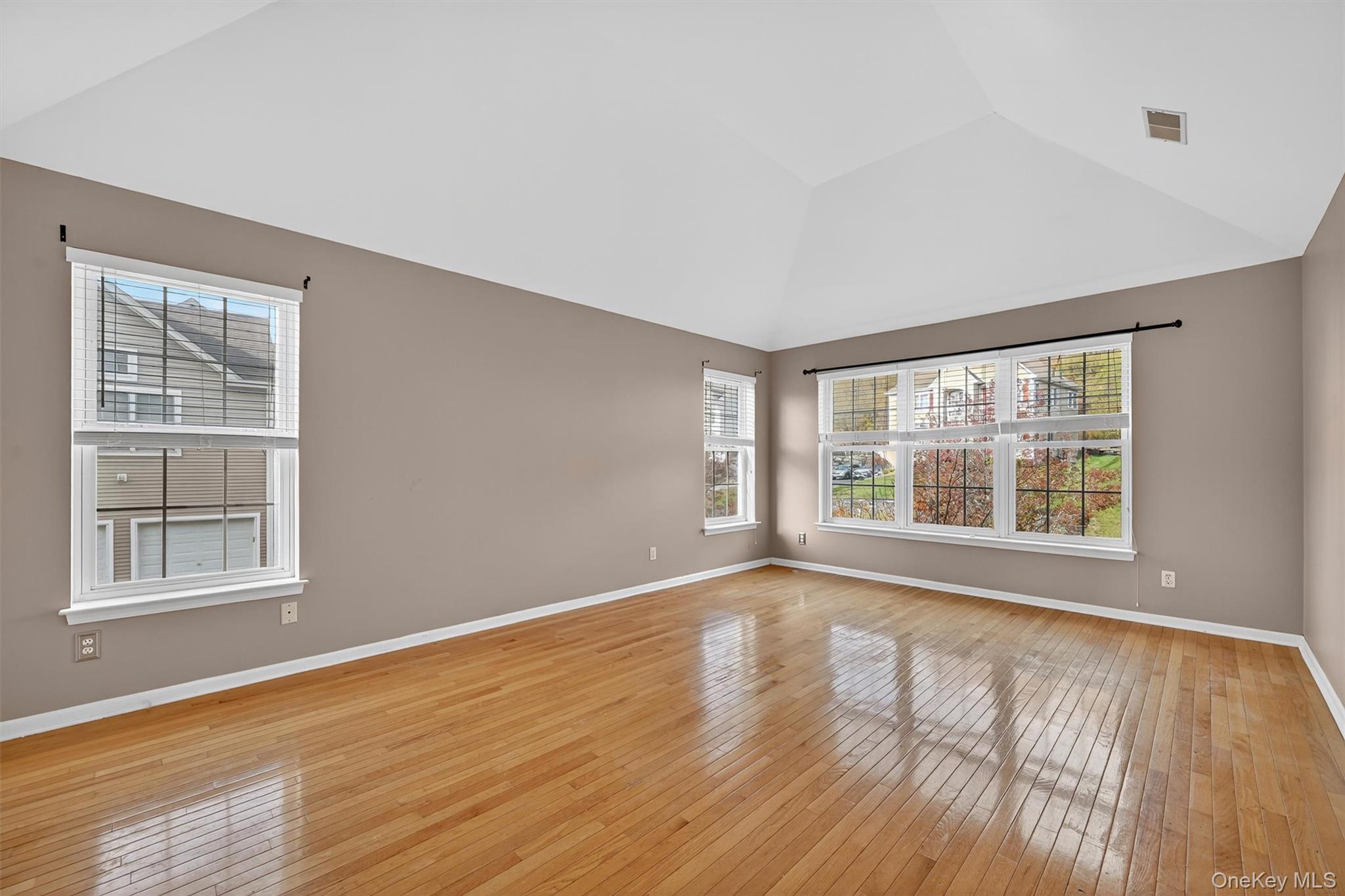 12 Heather Ridge Highland Mills, NY 10930 - Photo 21 of 41 a view of an empty room with wooden floor and a window