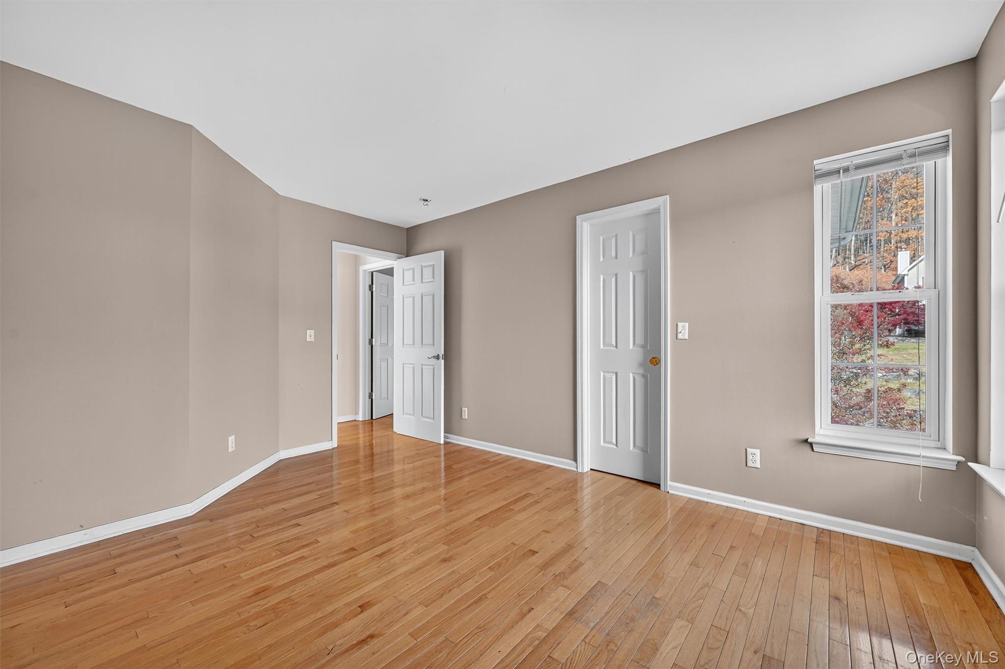12 Heather Ridge Highland Mills, NY 10930 - Photo 23 of 41 a view of an empty room with wooden floor and a window