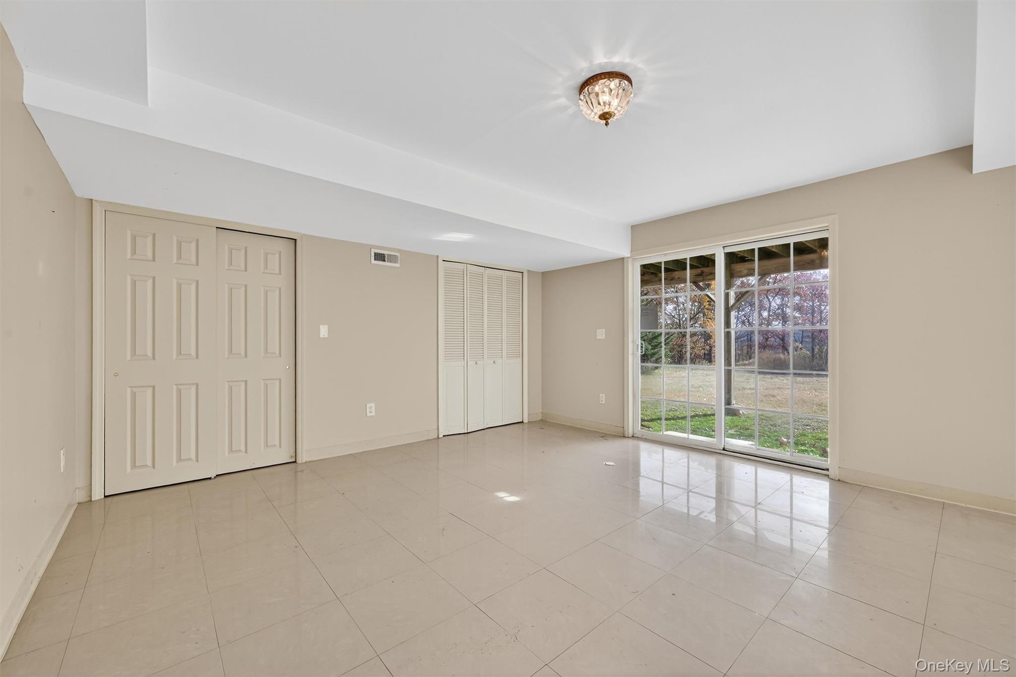 12 Heather Ridge Highland Mills, NY 10930 - Photo 32 of 41 a view of an empty room with a window