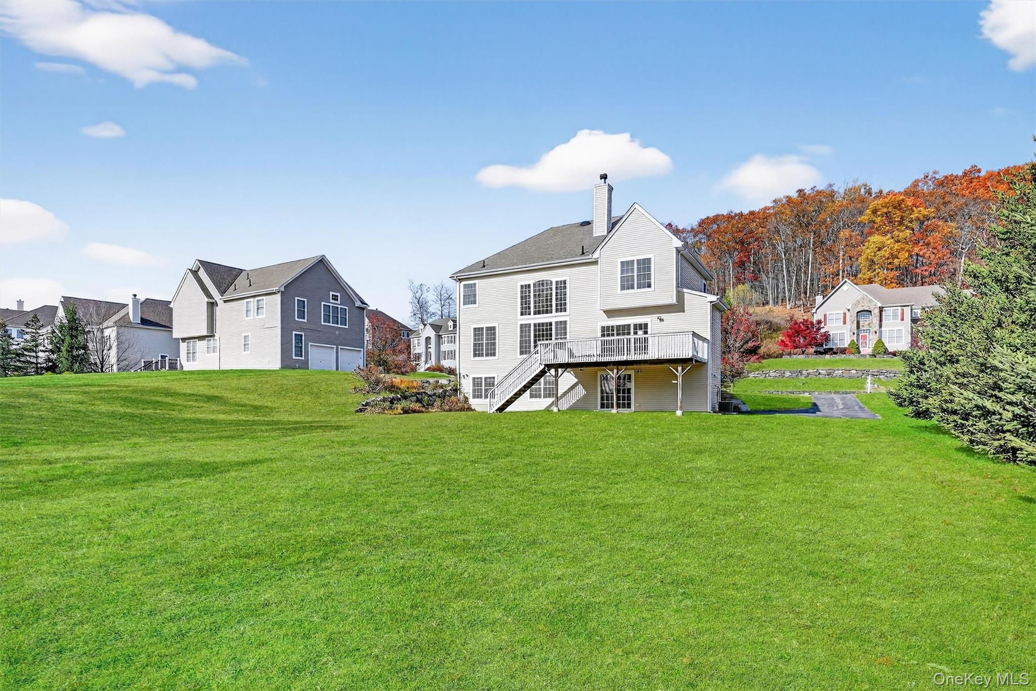 12 Heather Ridge Highland Mills, NY 10930 - Photo 35 of 41 a front view of a house with a garden and plants