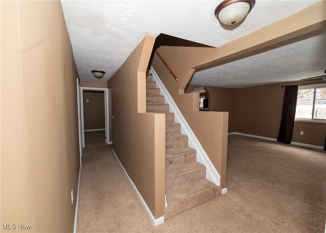 1549 Ridge Road Northeast New Philadelphia, OH 44663 - Photo 32 of 46 View of stairway to upper level