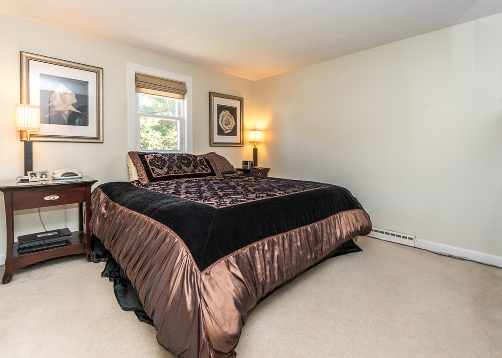 87 Evelyn Road Needham, MA 02494 - Photo 8 of 14 a bedroom with a bed and a window