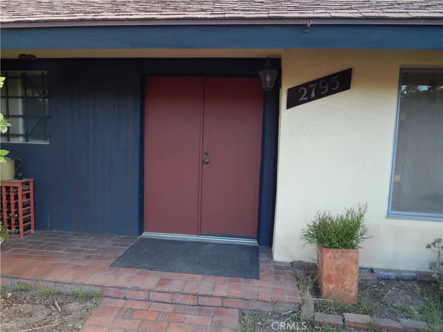 a view of a entryway door of house