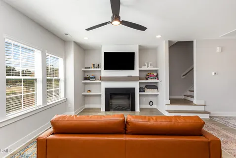 a kitchen with stainless steel appliances kitchen island granite countertop a stove a sink and a refrigerator