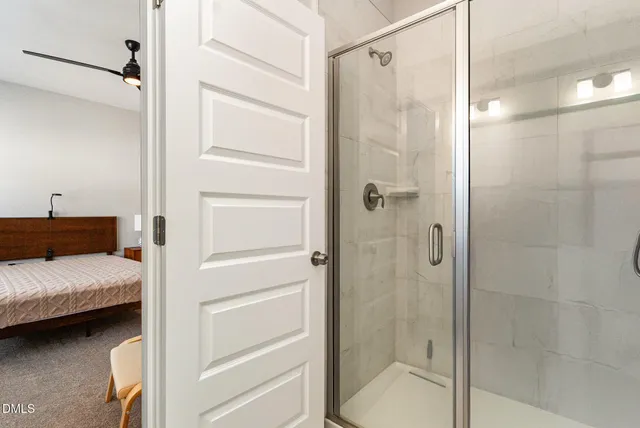 a bedroom with a bed a desk and chair