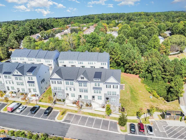 an aerial view of residential houses and outdoor space