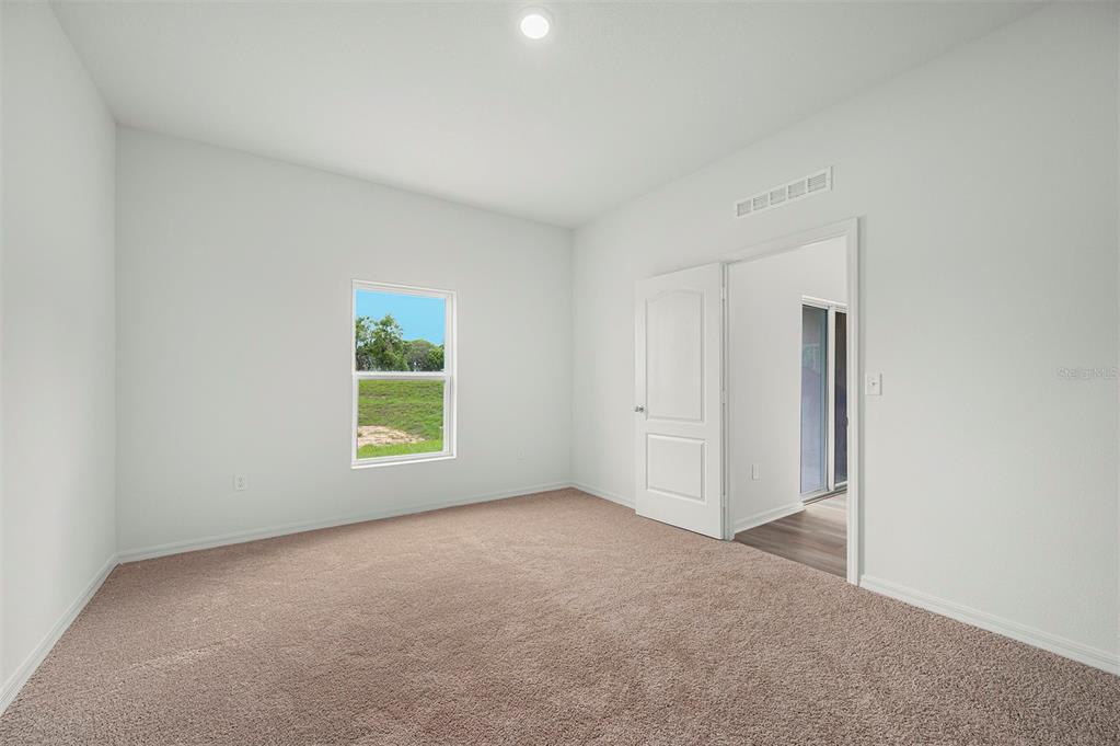 13283 Tula Loop Astatula, FL 34705 - Photo 11 of 19 an empty room with windows