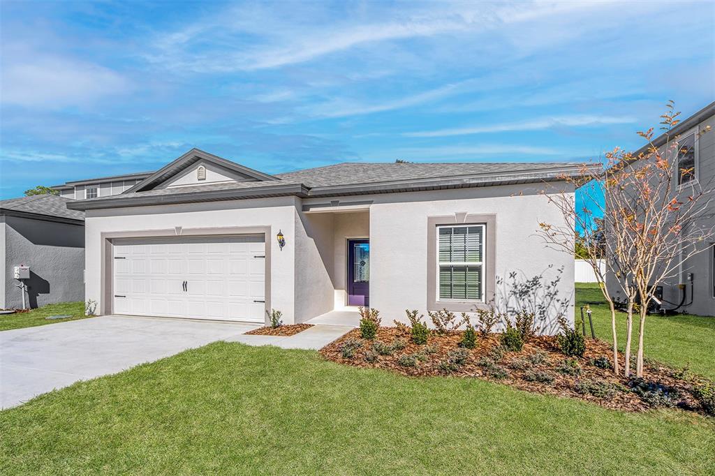 13283 Tula Loop Astatula, FL 34705 - Photo 2 of 19 front view of a house with a yard